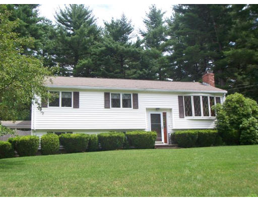16 Governor Fuller Road Billerica, MA 01821 - Photo 8 of 21 a front view of a house with a garden