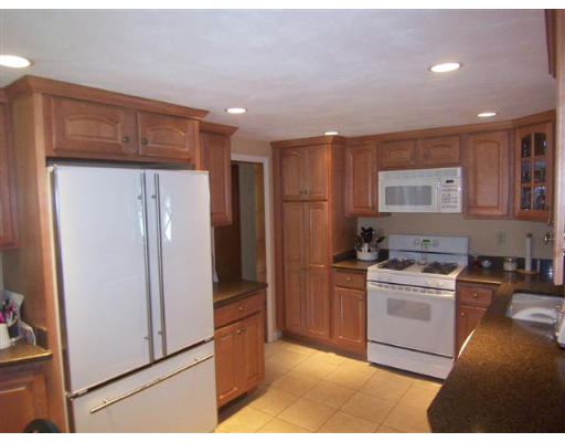 16 Governor Fuller Road Billerica, MA 01821 - Photo 9 of 21 a kitchen with a stove a refrigerator and a sink