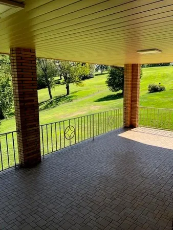 a view of a garden with an outdoor space