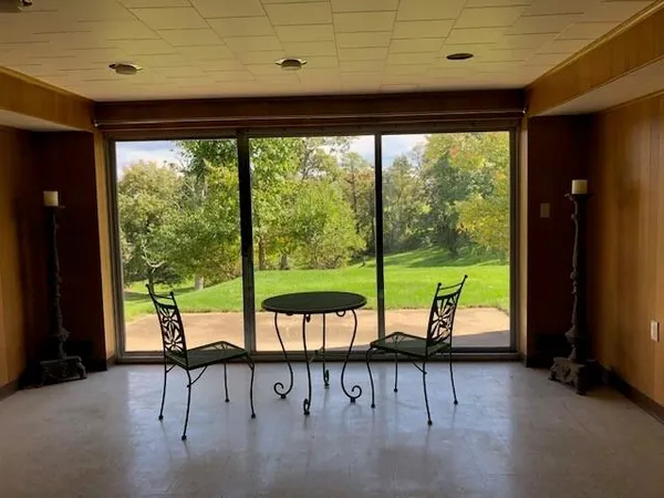 a view of a patio with a table chairs and a patio