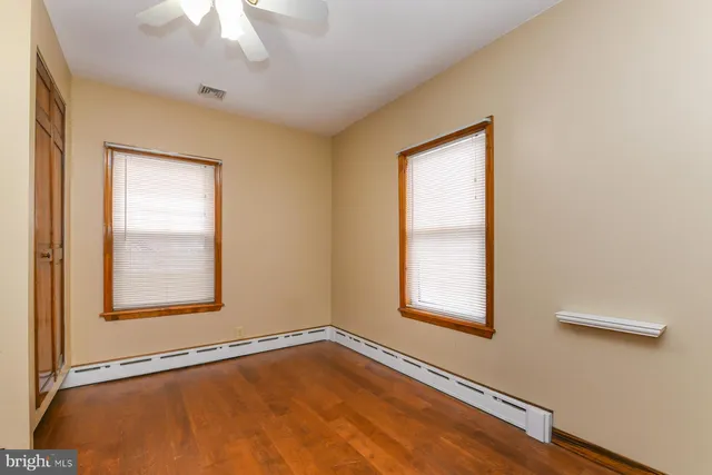 a view of outdoor space with wooden floor and iron stairs