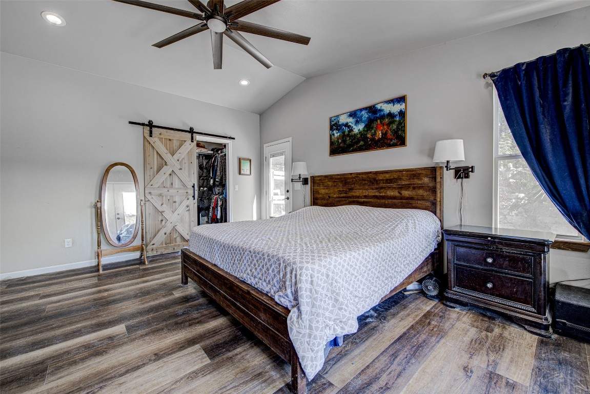 15101 Dexler Drive Austin, TX 78734 - Photo 16 of 26 a bedroom with bed and wooden floor