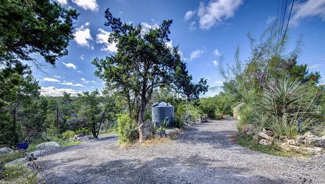 a backyard of a house with lots of green space