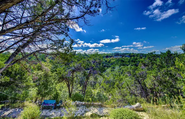 a view of a backyard of the house