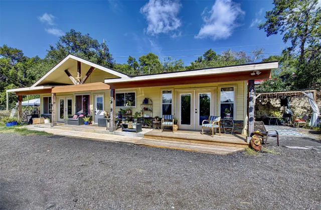 a view of a house with outdoor space and porch