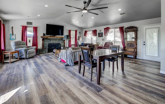 a view of a livingroom with furniture window and wooden floor