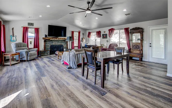 a view of a livingroom with furniture window and wooden floor
