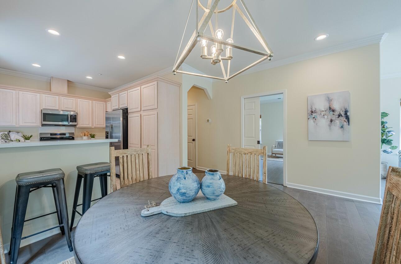 840 Seacliff Drive Aptos, CA 95003 - Photo 13 of 58 a kitchen with kitchen island stainless steel appliances a dining table chairs sink and cabinets