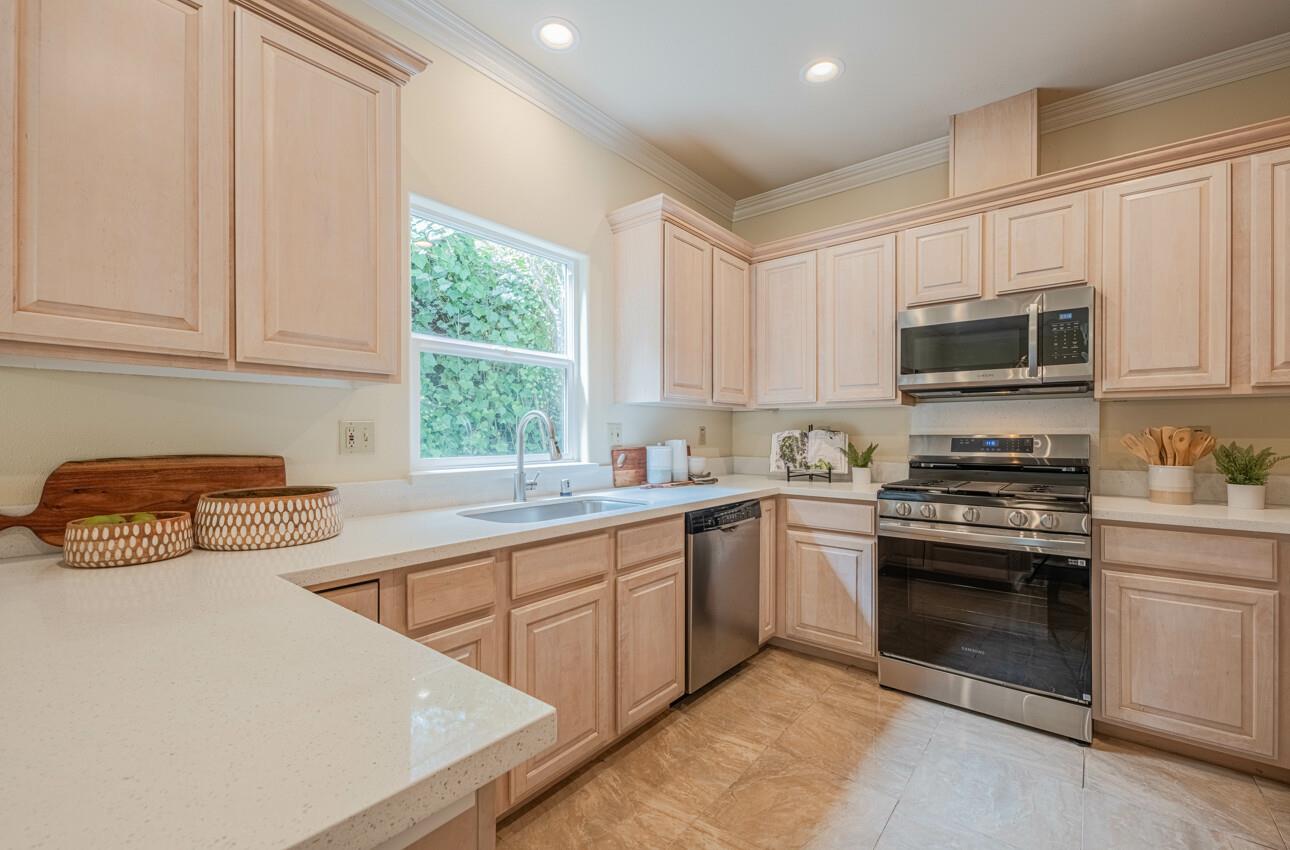 840 Seacliff Drive Aptos, CA 95003 - Photo 15 of 58 a kitchen with stainless steel appliances granite countertop a stove a sink and a microwave