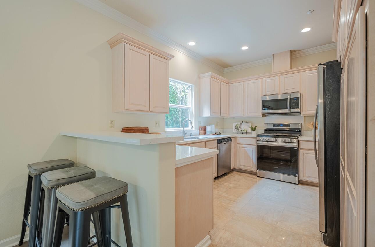 840 Seacliff Drive Aptos, CA 95003 - Photo 19 of 58 a kitchen with a refrigerator and a stove top oven