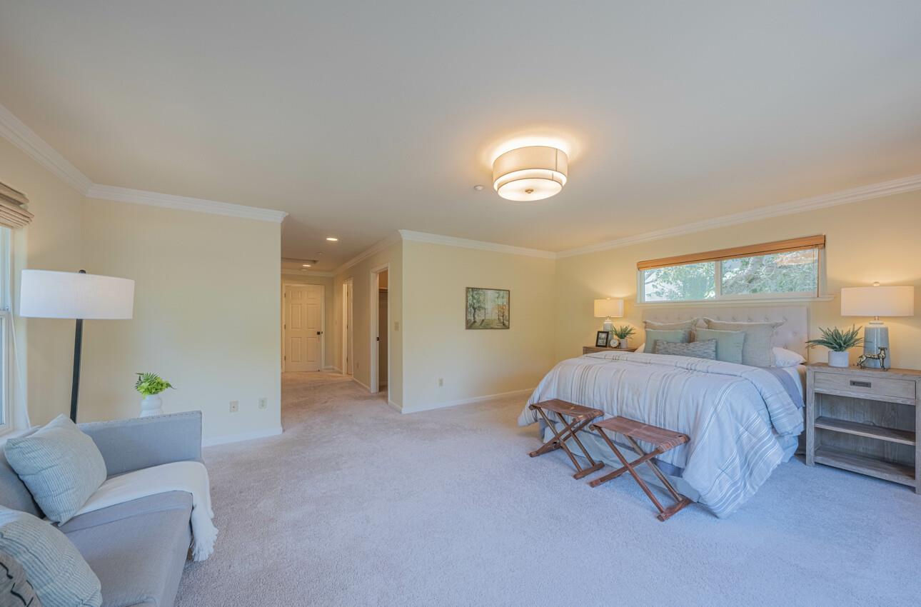 840 Seacliff Drive Aptos, CA 95003 - Photo 25 of 58 a spacious bedroom with a bed and a couch