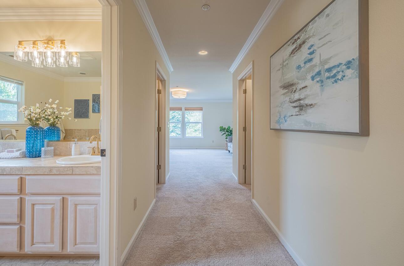 840 Seacliff Drive Aptos, CA 95003 - Photo 31 of 58 a view of a hallway with windows and chandelier