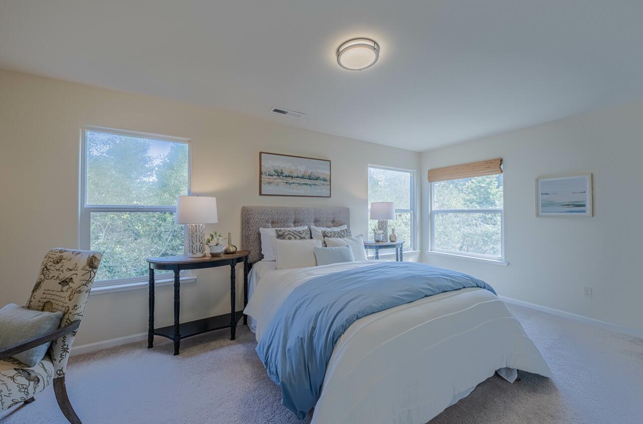 840 Seacliff Drive Aptos, CA 95003 - Photo 36 of 58 a bedroom with a bed and a table in it
