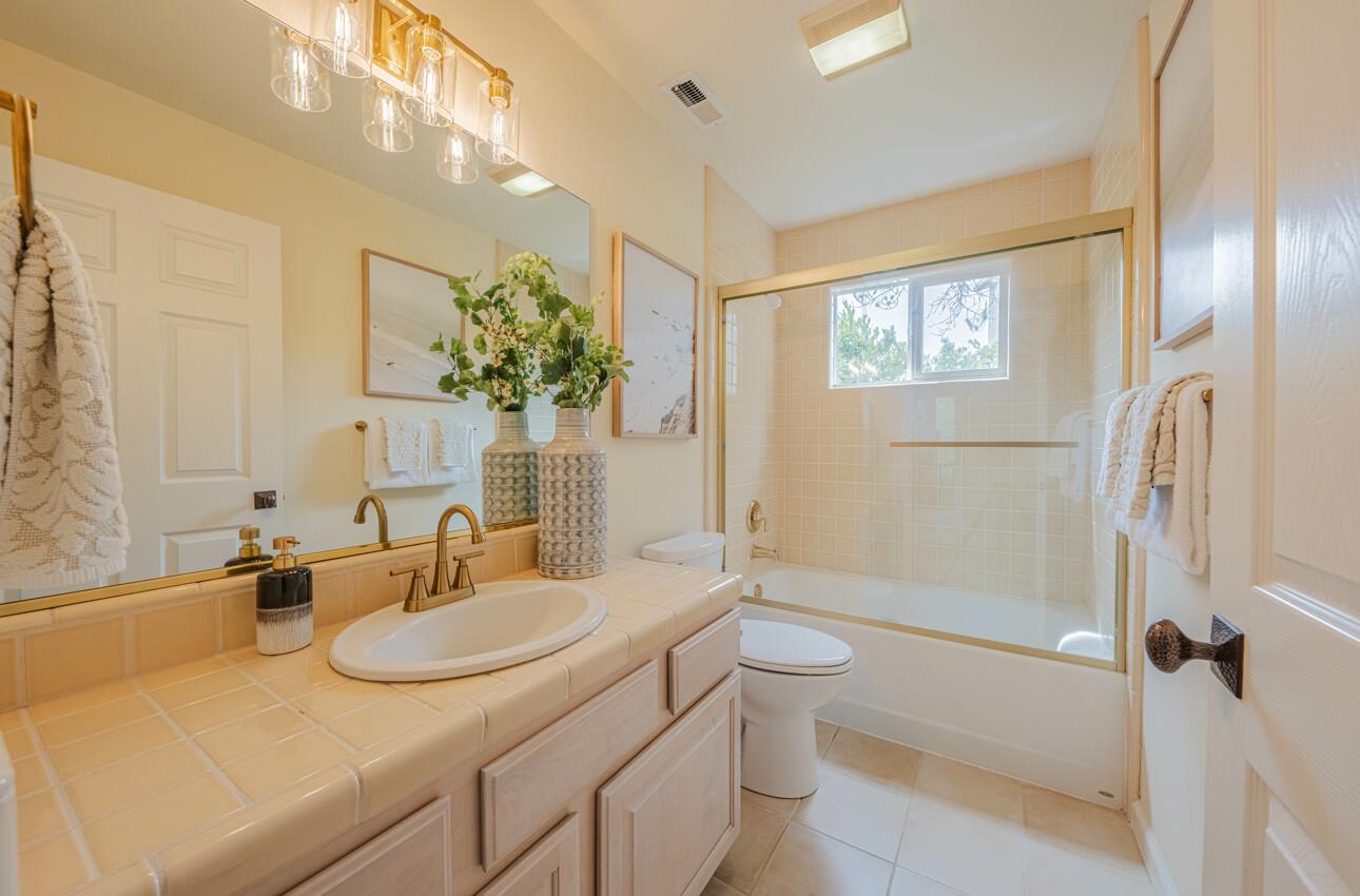 840 Seacliff Drive Aptos, CA 95003 - Photo 40 of 58 a bathroom with a granite countertop sink and a mirror