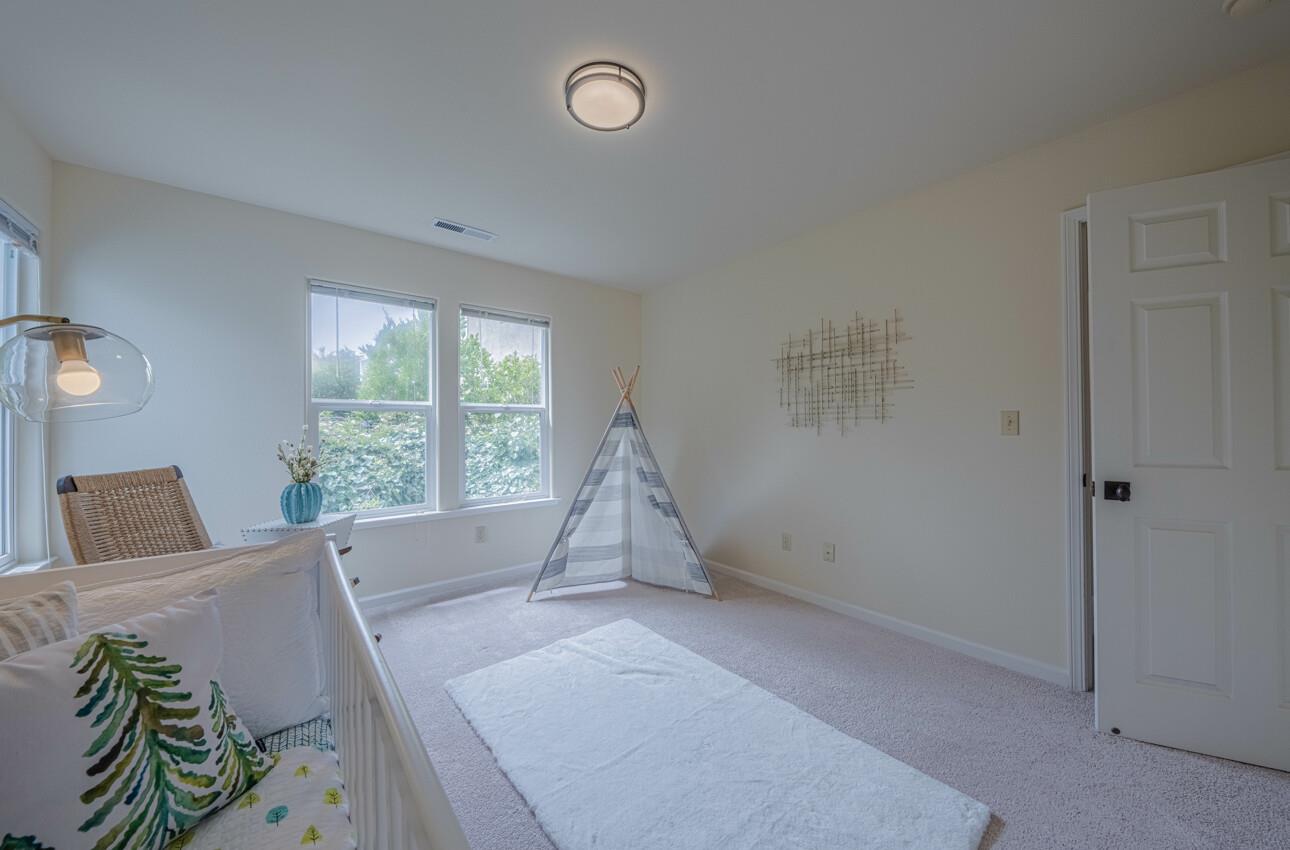 840 Seacliff Drive Aptos, CA 95003 - Photo 42 of 58 a living room with furniture and a floor to ceiling window