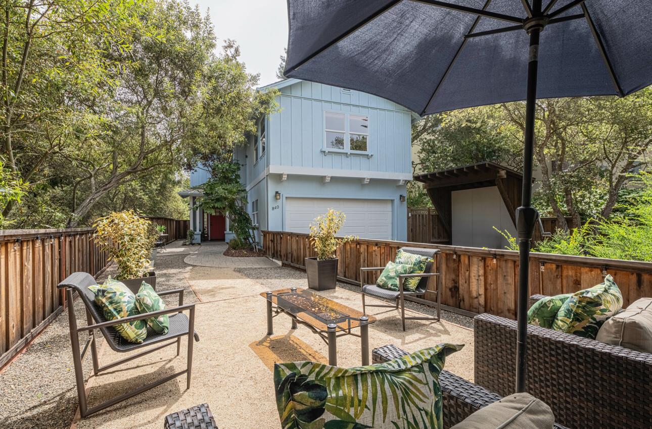 840 Seacliff Drive Aptos, CA 95003 - Photo 46 of 58 a view of a patio with couches table and chairs under an umbrella