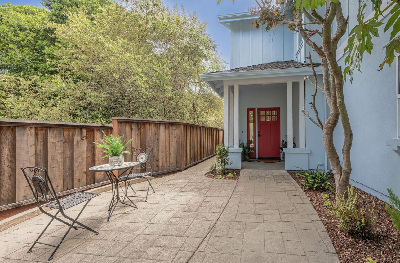 840 Seacliff Drive Aptos, CA 95003 - Photo 5 of 58 a view of backyard with table and chairs and wooden fence