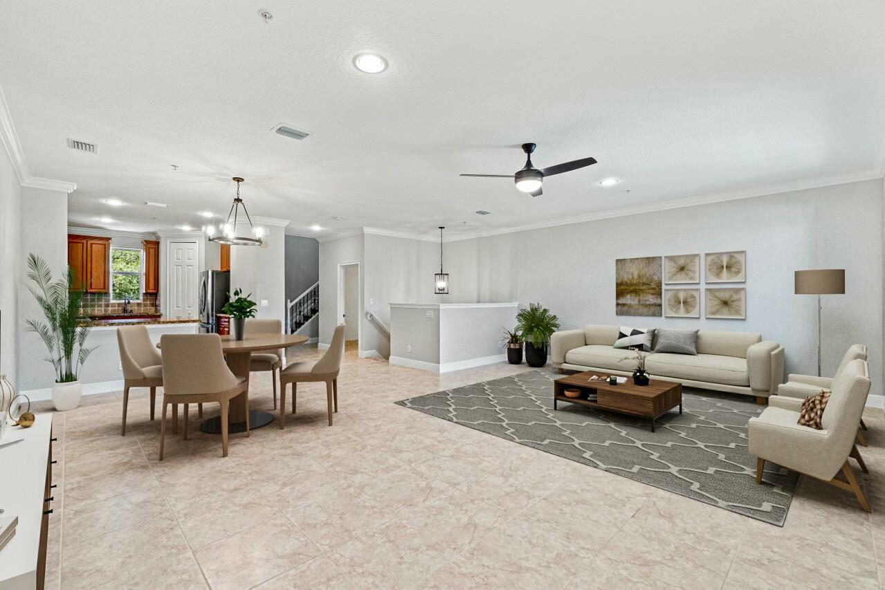 3016 Waterside Circle Boynton Beach, FL 33435 - Photo 3 of 50 a living room with furniture kitchen view and a large window