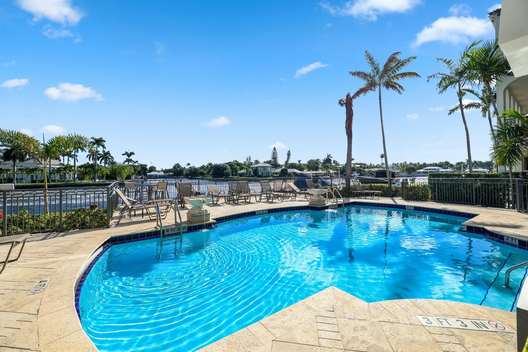 3016 Waterside Circle Boynton Beach, FL 33435 - Photo 36 of 50 a view of a swimming pool with a lake view