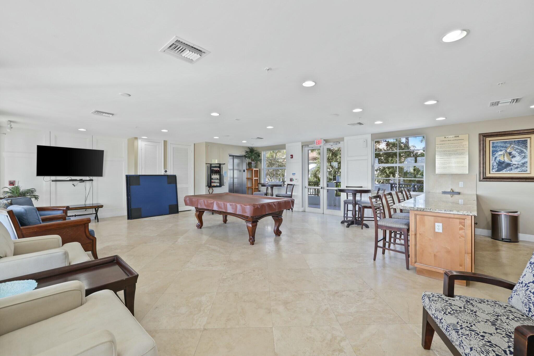 3016 Waterside Circle Boynton Beach, FL 33435 - Photo 40 of 50 a living room with furniture and a flat screen tv
