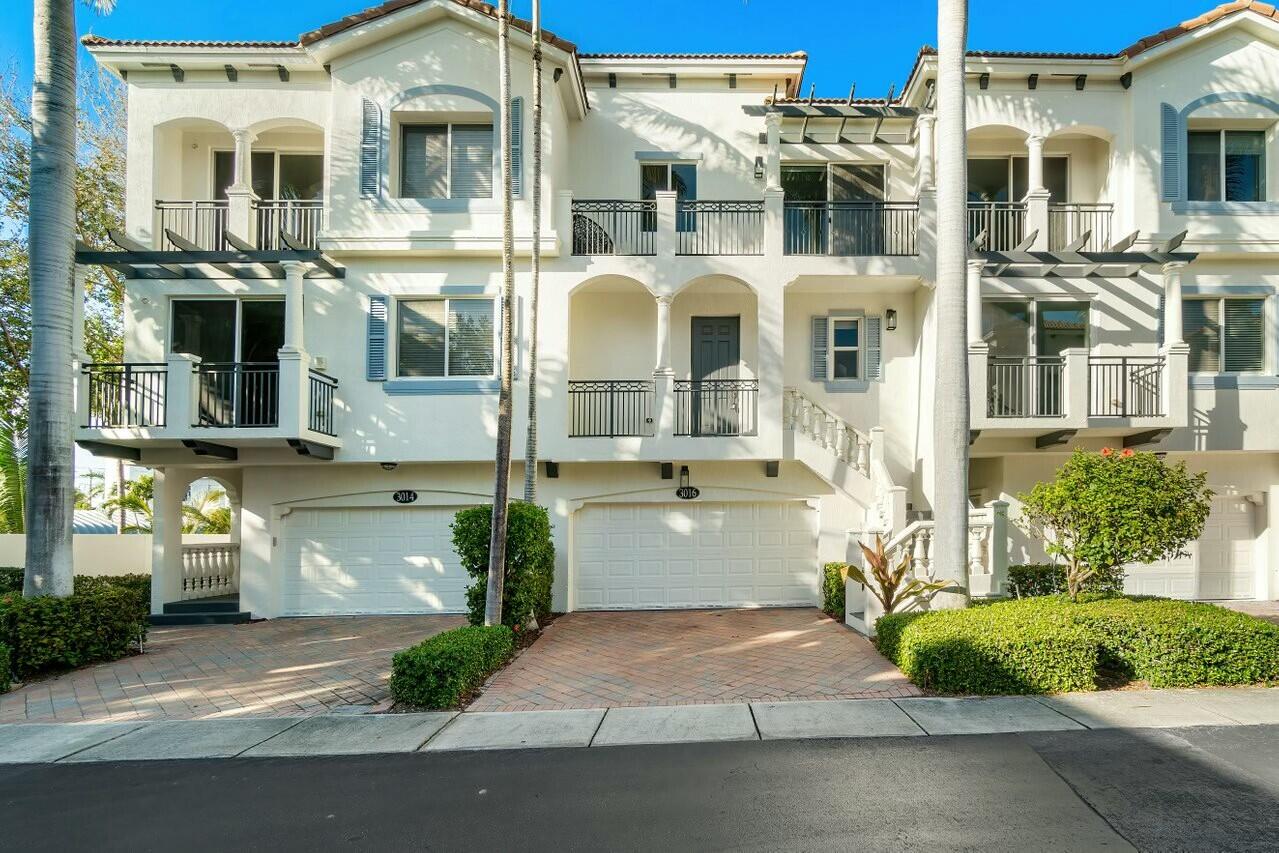 3016 Waterside Circle Boynton Beach, FL 33435 - Photo 48 of 50 a front view of a residential apartment building with a yard