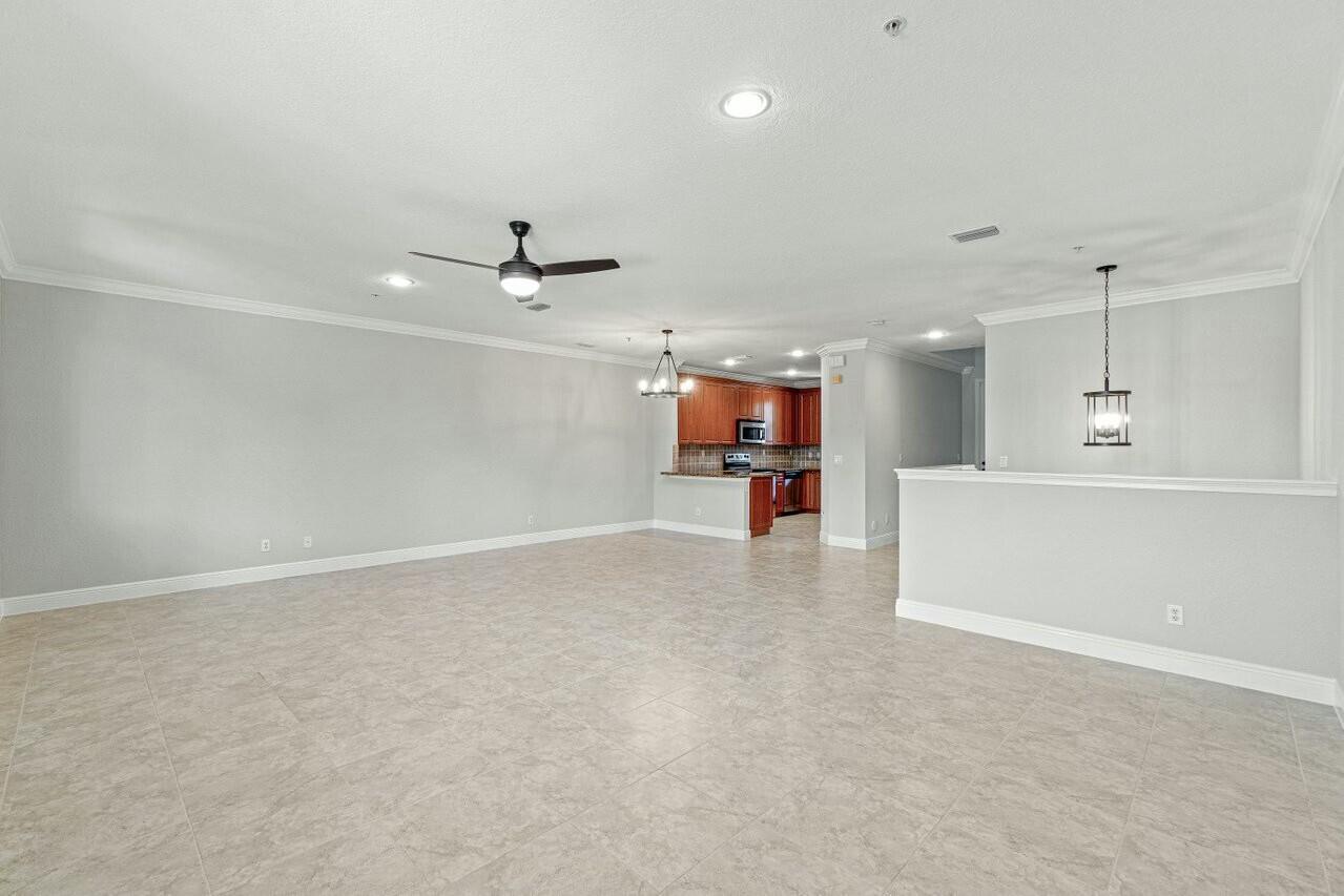 3016 Waterside Circle Boynton Beach, FL 33435 - Photo 8 of 50 an empty room with fireplace and ceiling fan