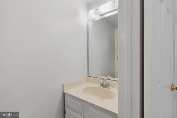 a bathroom with a sink and mirror
