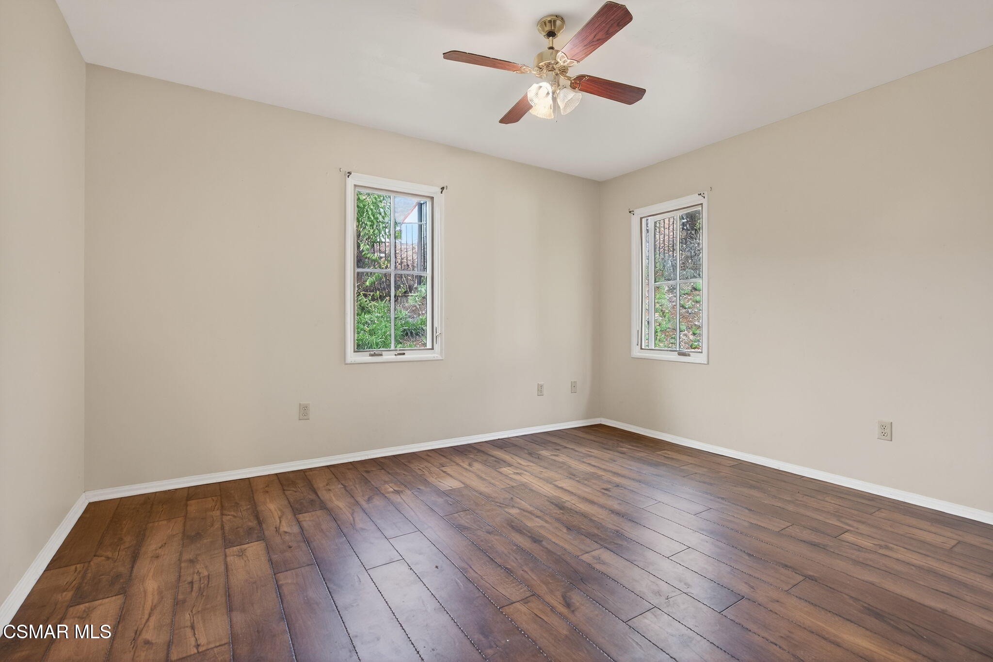 1560 Goodenough Road Fillmore, CA 93015 - Photo 52 of 81 a view of empty room with wooden floor and fan