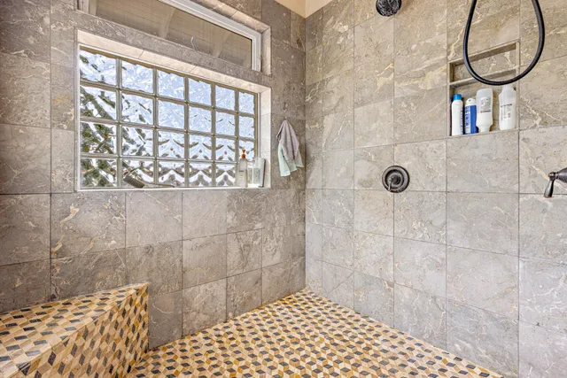 a view of a bedroom with wooden floor and balcony