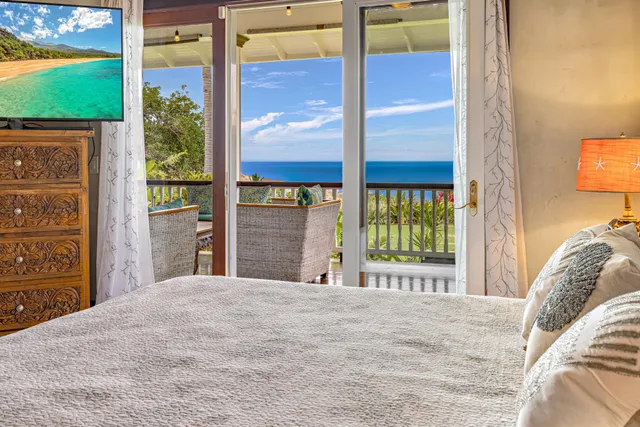 a view of living room kitchen and entryway