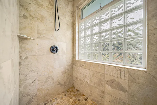 a bedroom with furniture and a book shelf