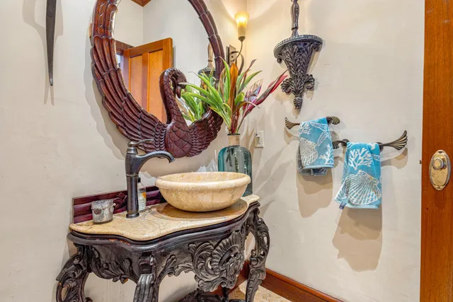 a porch with a table and chairs