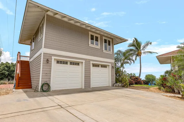 a living room with furniture a table and a large window