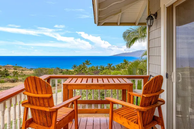 a kitchen with stainless steel appliances granite countertop a refrigerator sink stove and white cabinets