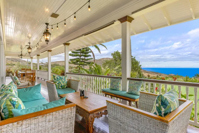 a view of a balcony with furniture