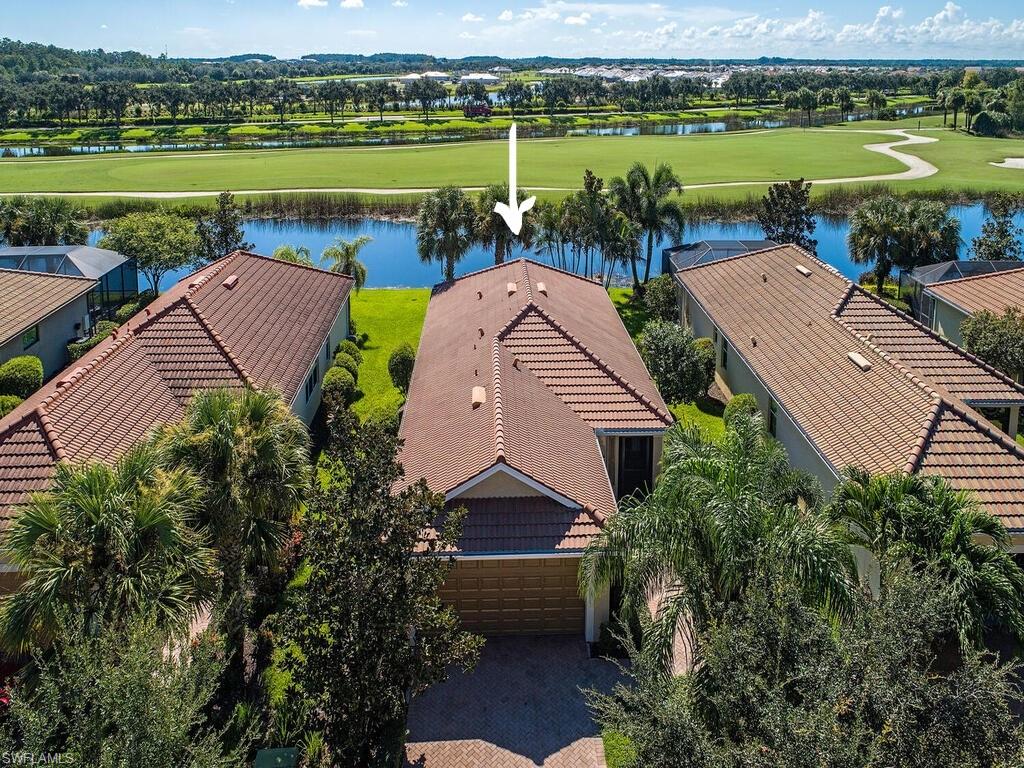 5784 Declaration Court Ave Maria, FL 34142 - Photo 12 of 21 an aerial view of a house with a garden and lake view