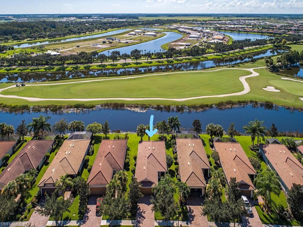 5784 Declaration Court Ave Maria, FL 34142 - Photo 13 of 21 an aerial view of residential houses with outdoor space and swimming pool