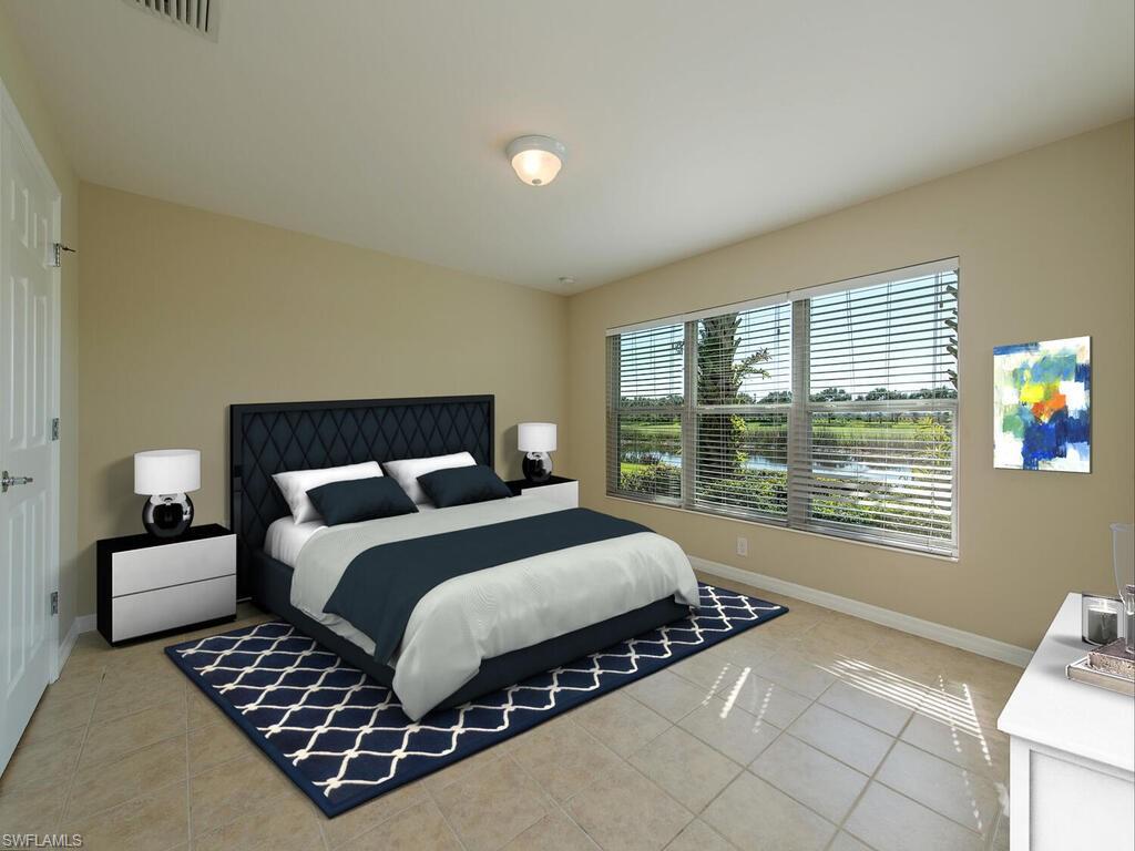 5784 Declaration Court Ave Maria, FL 34142 - Photo 5 of 21 a bedroom with a bed and a window
