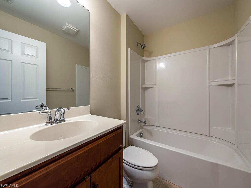 5784 Declaration Court Ave Maria, FL 34142 - Photo 8 of 21 a bathroom with a sink a toilet and shower