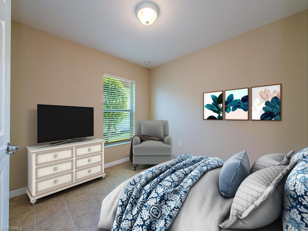 5784 Declaration Court Ave Maria, FL 34142 - Photo 9 of 21 a bedroom with furniture and a flat screen tv