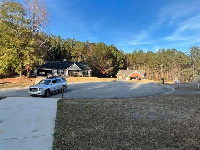 a view of car parked on the side of the road