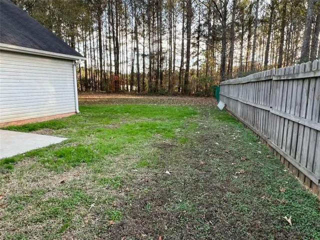 a view of a backyard with tree s