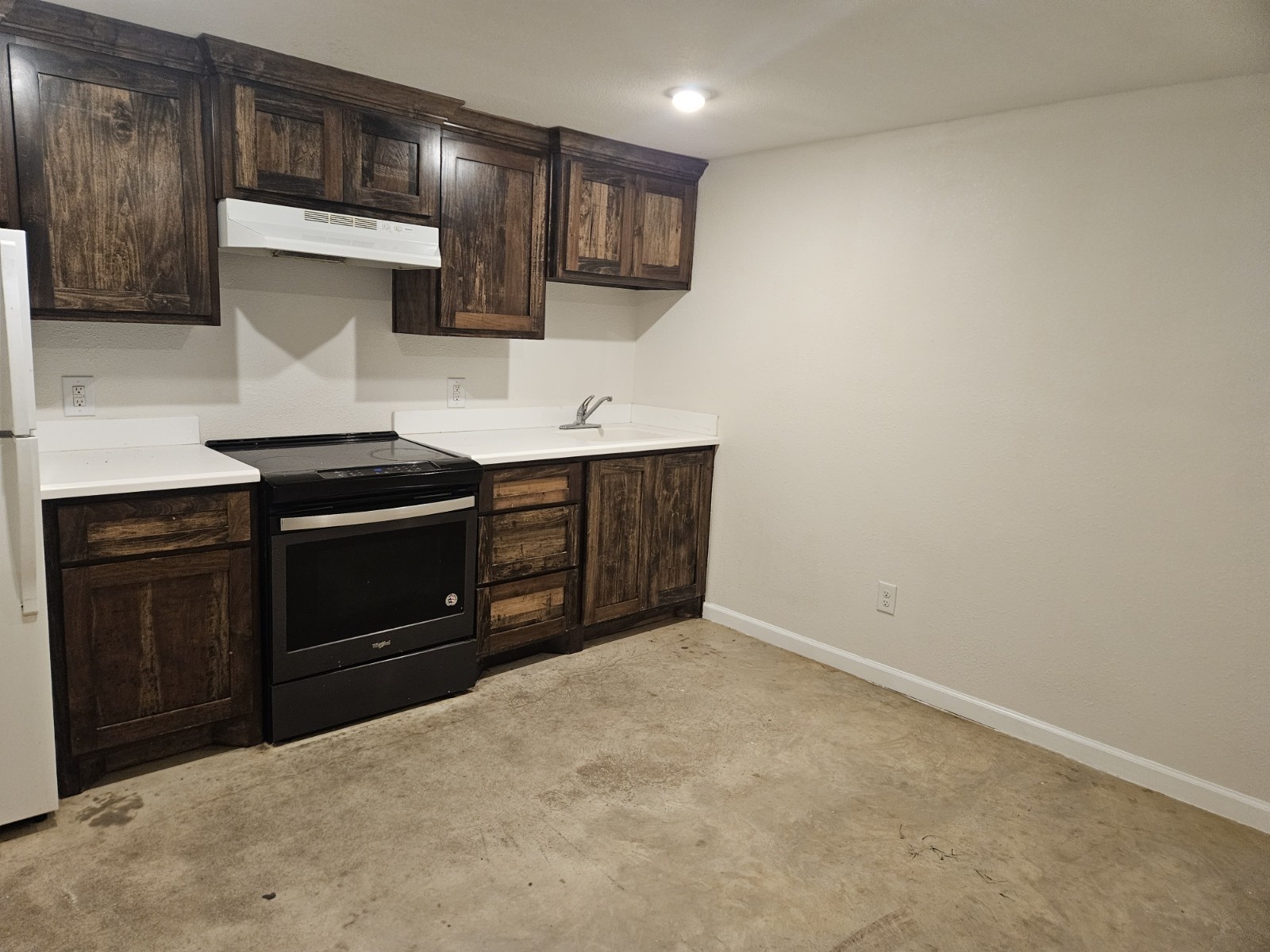 1503 Spur 529 Rosenberg, TX 77471 - Photo 3 of 6 a kitchen with stainless steel appliances a stove and a refrigerator
