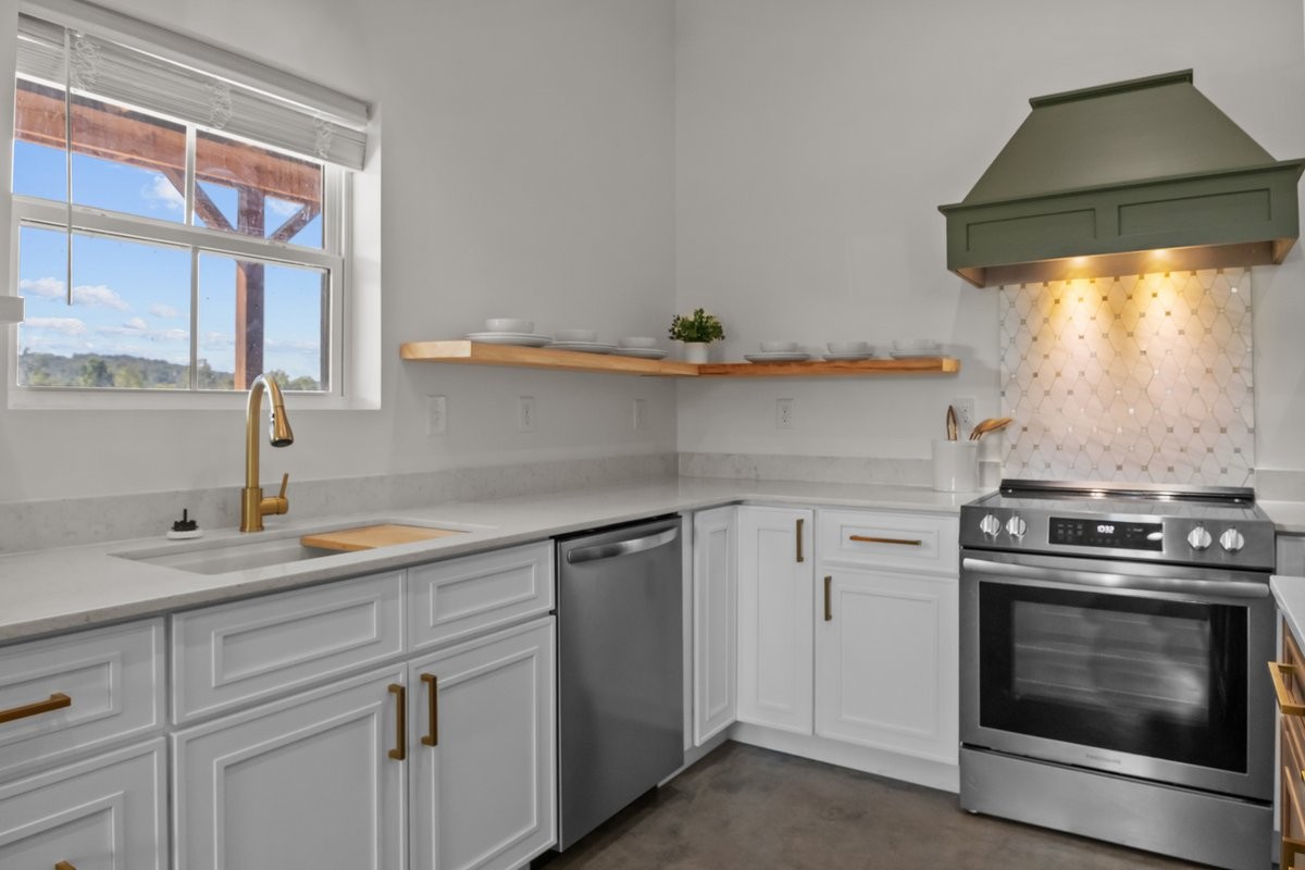 6405 Clydeton Road Waverly, TN 37185 - Photo 4 of 11 a kitchen with a stove and cabinets