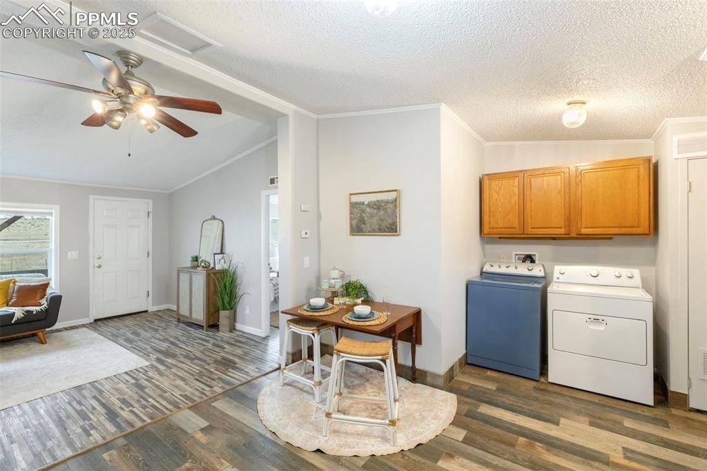 15345 Trigger Road Peyton, CO 80831 - Photo 13 of 26 a living room with furniture and a flat screen tv