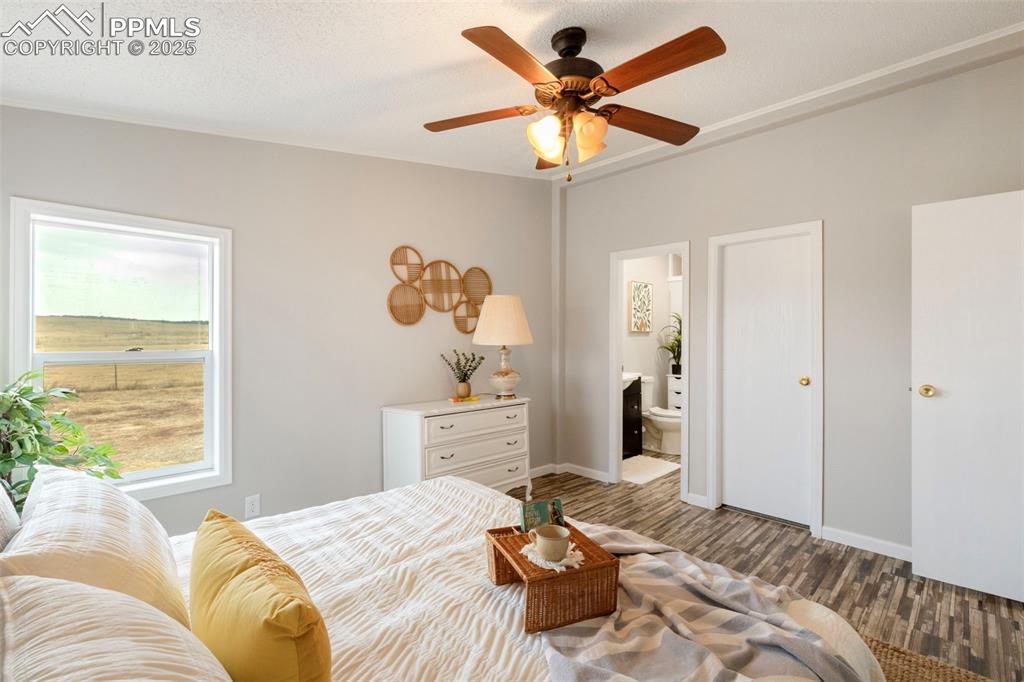 15345 Trigger Road Peyton, CO 80831 - Photo 16 of 26 a bedroom with a large bed and a window