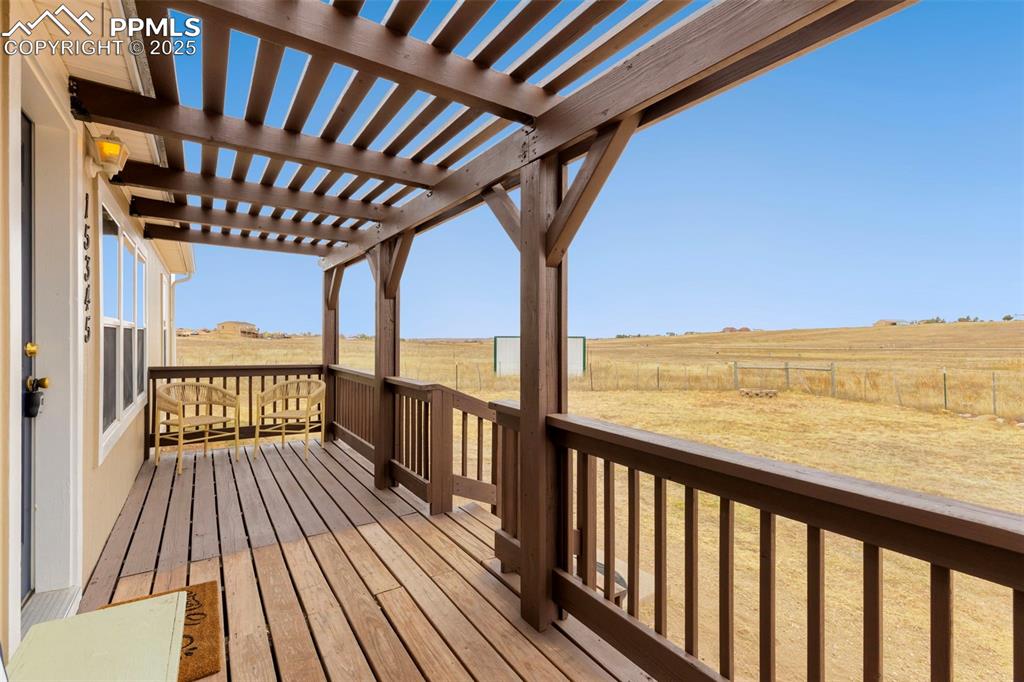 15345 Trigger Road Peyton, CO 80831 - Photo 4 of 26 a view of balcony with wooden floor