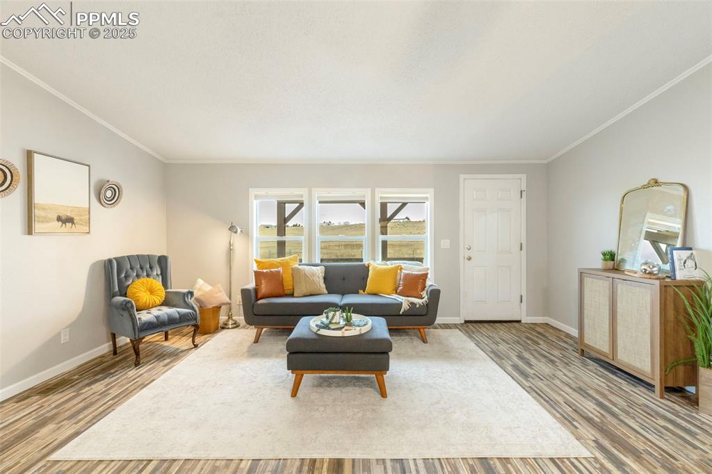 15345 Trigger Road Peyton, CO 80831 - Photo 7 of 26 a living room with furniture and a table