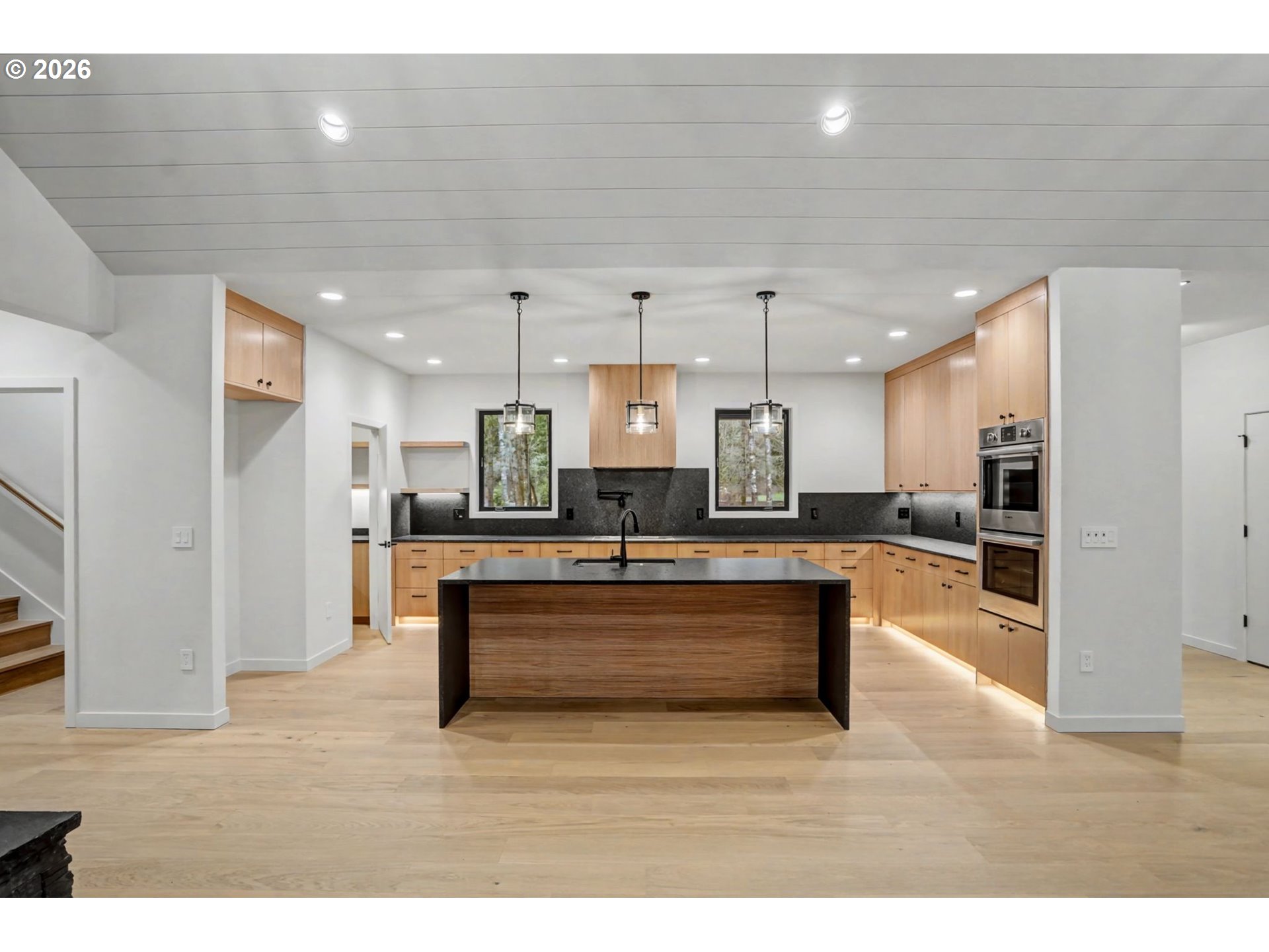 19850 Winters Hill Road Southeast Silverton, OR 97381 - Photo 12 of 48 a living room with stainless steel appliances kitchen island a refrigerator and a wooden floor