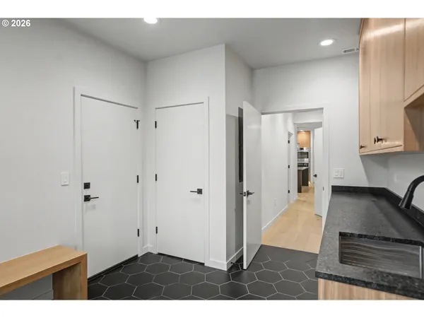 a view of kitchen with furniture and wooden floor
